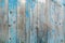 Vintage wood background with blue color peeling paint.