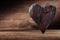 Vintage wood heart standing on woden background