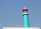 Vintage, wooden blue and pink lighthouse.