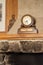 Vintage wooden clock on the mantelpiece