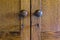 Vintage wooden closet doors of wardrobe with knobs and keys