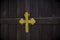 Vintage wooden door with metallic golden colored Christian Cross in Christian Church