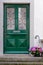 Vintage Wooden Doorway and Colorful of Flowers Decoration, Home Decorative Design and Plantation. Single Wooden Door in Old Town