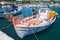 Vintage wooden fishing boat moored in port