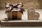 Vintage wooden hearts and giftbox on wood background