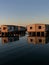 Vintage wooden houses on the shoreline of a tranquil body of water in Jeddah, Saudi Arabia