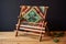 vintage wooden loom with woven tapestry