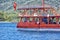 Vintage wooden pirate schooner in the open ocean against the background of the sea horizon. Tourist cruises in the Mediterranean