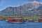 Vintage wooden pirate schooner in the open ocean against the background of the sea horizon. Tourist cruises in the Mediterranean