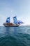 Vintage Wooden Ship with Blue Sails