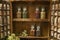 Vintage Wooden Spice Rack or Storage Cabinet and six glass bottles