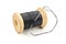 Vintage wooden spool of black thread and needle on white background
