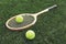 Vintage wooden tennis racket on grass