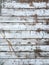 Vintage wooden white and brown background - old wooden bridge or palisade fence. Weathered planks texture. Vertical composition