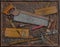 Vintage woodworking tools over rusty plate