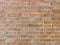 vintage worm brick wall stained closeup retro style weathered red surface aged bricks