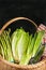 Vintage woven reed basket of organic green vegetables