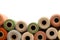 Vintage Yarn Spools Bordering White Background