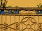 Vintage yellow balcony with metal decoration and old wooden rail