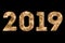 Vintage yellow gold sparkly glitter lights and glowing effect simulating leds happy new year 2019 word text on black background wi