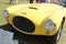 Vintage yellow sportscar front detail