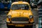 Vintage yellow taxi waiting for passenger near Mullick Ghat Flower Market in Kolkata, India