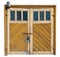 Vintage yellow wooden garage doors with glass windows