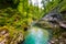 Vintgar gorge, Slovenia. River near the Bled lake with wooden tourist paths, bridges above river and waterfalls. Hiking in the Tri