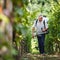 Vintner in his vineyard spraying chemicals