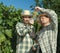 Vintners examining grapes