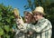 Vintners examining grapes