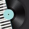 Vinyl with piano keys background