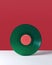 Vinyl retro record on a double red white background with copy space. Audio technology concept