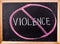 Violence word on blackboard