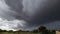 A violent summer thunderstorm accompanied by heavy rain, gale force winds, frequent lightning and loud thunder approaches Perth,