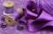 Violet accessories for needlework: fabric, ribbon, buttons, coil