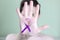 Violet awareness ribbon on the palm of a young girl. Copy space - the concept of domestic violence in the family, symbol