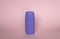 Violet blank unbranded cosmetic plastic bottle for shampoo, gel, lotion, cream, bath foam pink background.