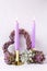 Violet color burning candles, decorative heart and succulents e