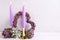 Violet color burning candles, decorative heart and succulents e