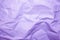 Violet crumpled paper texture background