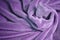 Violet furry fleece fabric Blanket with a lot of folds relief