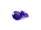 Violet gemstones on a white background