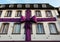 Violet huge ribbon on a building facade