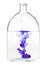 Violet ink dissolves in water in bottle isolated