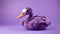 Violet Knitted Duck Toy On Purple Background