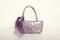 Violet leather bag on white. Purple purse with matching scarf.