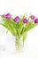Violet purple tulips colorful bouquet in vase.Beautiful tenderness flowers,close up.Spring floral romantic blank card