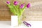 Violet purple tulips colorful bouquet in vase.Beautiful tenderness flowers,gift jewelry box,close up.Spring floral