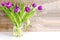 Violet purple tulips colorful bouquet in vase. Beautiful tenderness flowers macro.Spring floral romantic gift card
